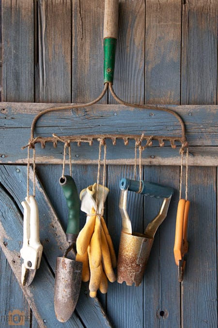 Rake rack holding garden tools