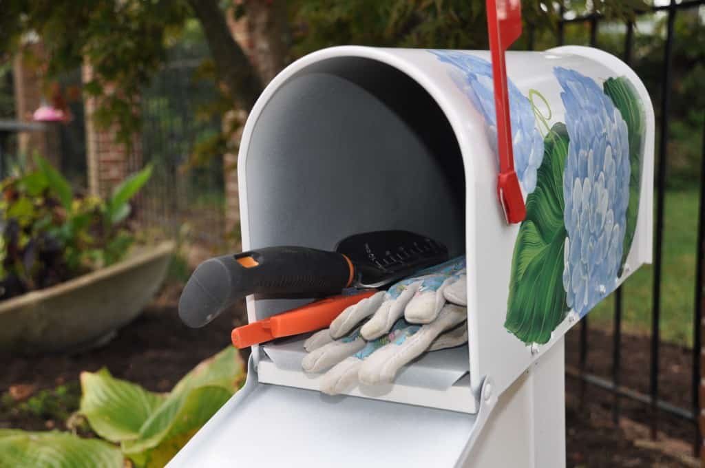 Mailbox filled with garden tools