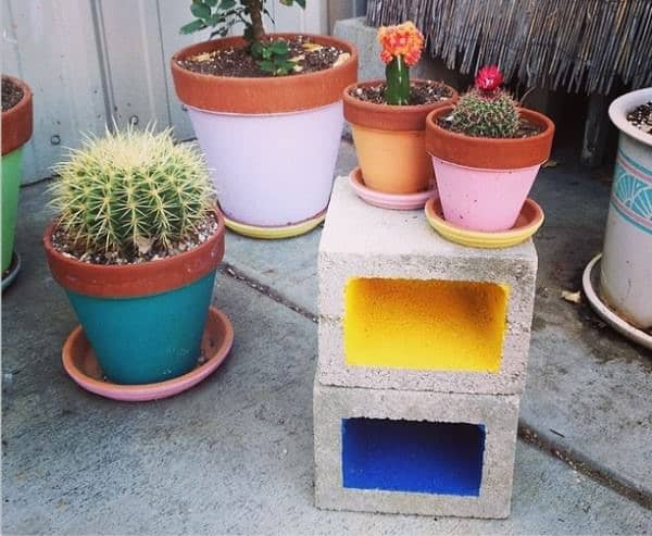 Cinder block table with potted plants on it
