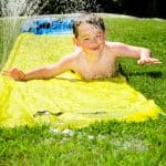 child on water slide