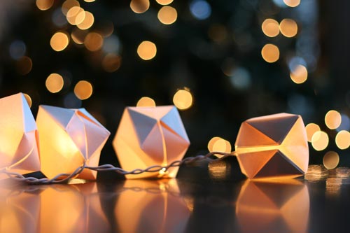 Origami cubes wrapped around christmas lights